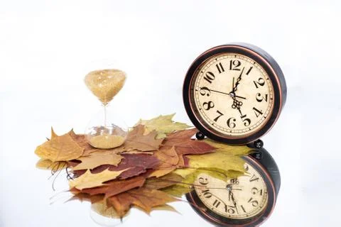 Daylight Saving Time. Wall Clock going to winter time. Stock Photos