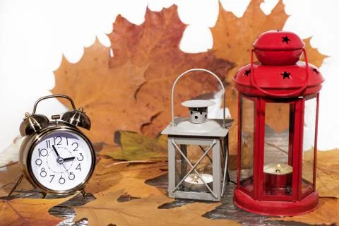 Daylight Saving Time. Wall Clock going to winter time. Autumn abstraction. Stock Photos