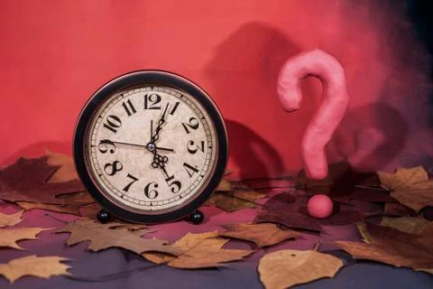 Daylight Saving Time. Wall Clock going to winter time. Autumn abstraction. Stock Photos