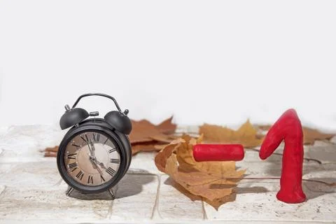 Daylight Saving Time. Wall Clock going to winter time. Autumn abstraction. Foto stock