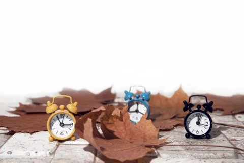 Daylight Saving Time. Wall Clock going to winter time. Autumn abstraction. Stock Photos