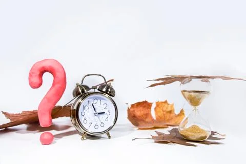 Daylight Saving Time. Wall Clock going to winter time. Autumn abstraction. Fa Stock Photos