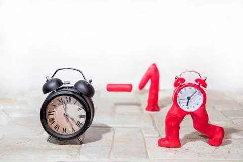 Daylight Saving Time. Wall Clock going to winter time. Autumn abstraction. Fa Stock Photos