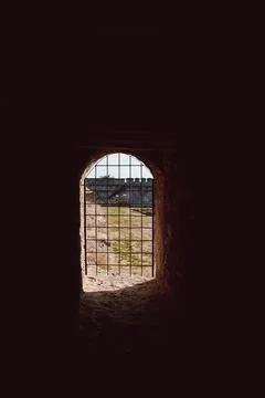 Daylight seen through iron prison bars Stock Photos