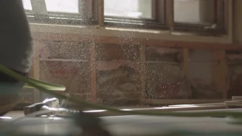 Daylight spills into the construction site through beautiful dust Stock Footage 144294604