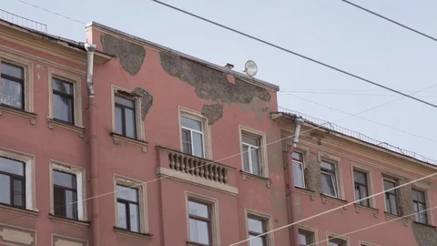 Daylight view of old pink historical building with several windows on sunny day Stock Footage 107112294
