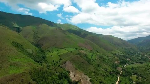 Daytime 360 Aerial Drone View Orbiting Over Green Mountain Valley Waterfall and Stock Footage 345241240