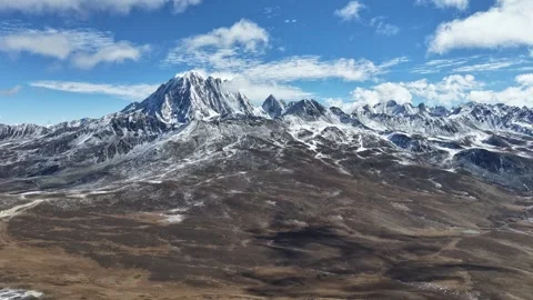 Daytime Aerial Hyperlapse of Yala Snow Mountain Sichuan, China Stock Footage 320352359