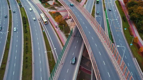 Daytime aerial shot of complicated intersecting highway with various vehicles Stock Footage 221373463