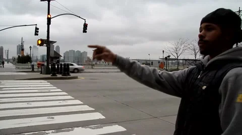 Daytime black man trying to catch a cab Stock Footage 54469627