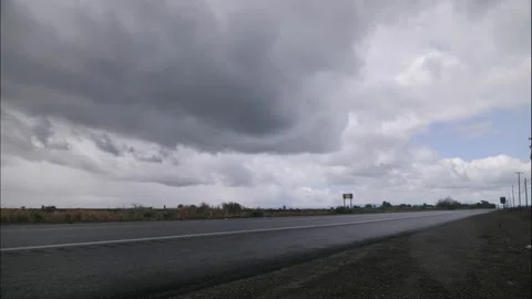 Daytime Cloudy To Bright Timelapse By A Road: Fairly Cool Stock Footage 192048603