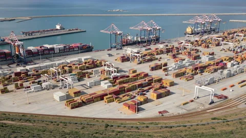 Daytime Container Terminal with Docked Ships and Stacking Cranes Stock Footage 338112180
