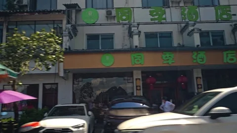 Daytime Dashcam View of a Typical Commercial Street in Guilin Region 스톡 동영상 335306077