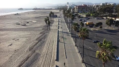 Daytime Drone Pullback Over Santa Monica Boardwalk and Pier Area Stock Footage 332323743