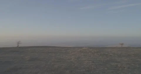Daytime Drone Reveal from Behind a Hill of Wind Farm, Russia Stock-Footage 344035288