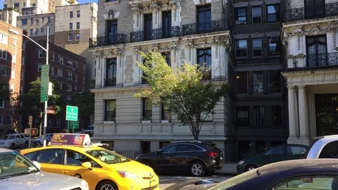 Daytime DX Establishing shot CV up corner white stone brick apartment Upper West Stock Footage 83550904