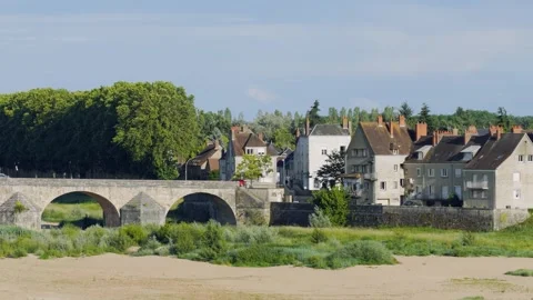 Daytime footage of the iconic stone bridge crossing the Loire River in Gien Stock Footage 346723630