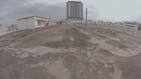 Daytime FPV Drone Flyover of Kuala Lumpur Rooftop Parking Stock Footage 303755017