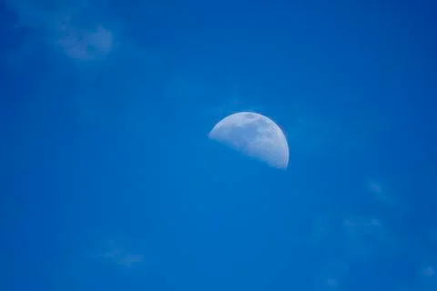 Daytime moon and clouds Stock Photos