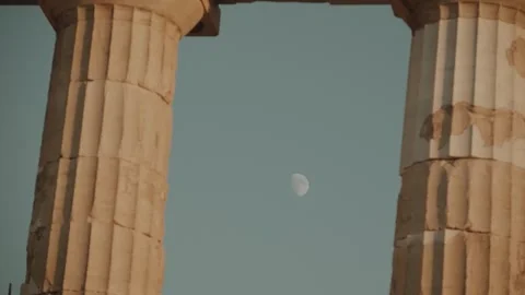 Daytime Moon Framed by Ancient Columns on the Athens Acropolis Stock Footage 345687360