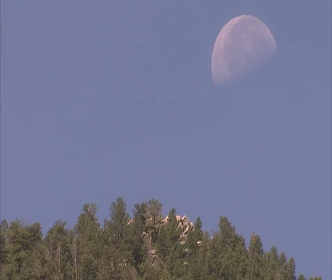Daytime moon setting over Mickey Mouse Rock Stock Footage 86691284