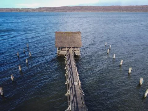 Daytime neutral density filter natural minimalist seascape pier. View of boats Stock-Fotos