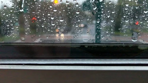 Daytime raindrop spalsh on window ledge streetview Stock Footage 100606686