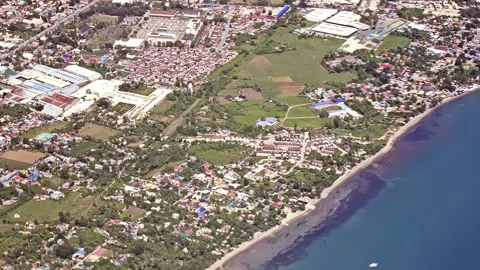 Daytime scene outside a plane as it approaches Mactan-Cebu International Stock Footage 296720171