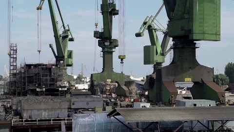 Daytime shot of cranes operating in Gdanska Shipyard. Stock Footage 108685939