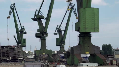Daytime shot of cranes operating in Gdanska Shipyard Stock Footage 108687811
