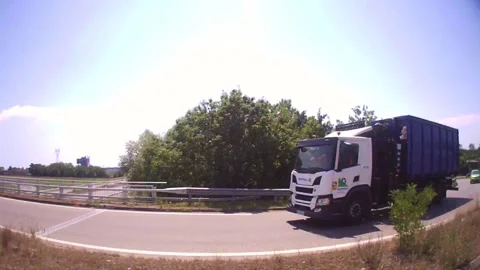 Daytime side car rig driving on highway, cinematic motion travel shot - B Stock Footage 319188495
