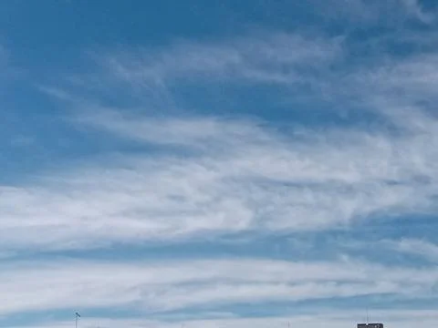 Daytime Sky with Horizontal Cloud Formations and Distant Horizon Stock Photos