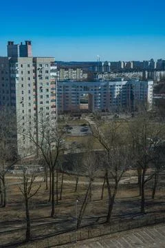 Daytime Soviet era suburb with semicircular arch housing block Stock Photos
