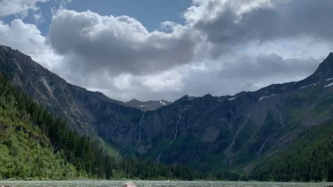 Daytime time lapse of clouds above mountain and lake 스톡 동영상 113951178