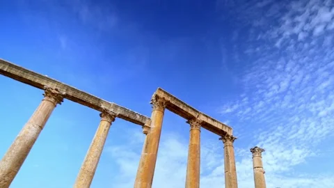 Daytime timelapse of ancient Roman columns under a moving cloudy sky in Jerash Stock Footage 336227139