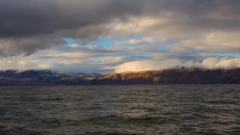 Daytime Timelapse of moving white, grey clouds over lake Sevan Stock Footage 254855698
