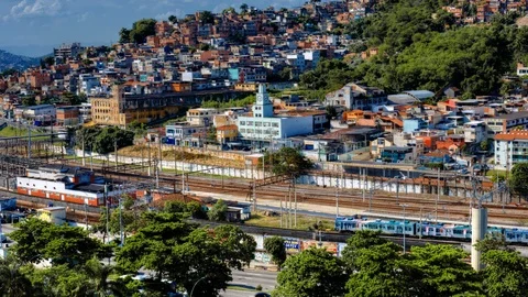 Daytime timelapse of trains passing in front of favela downtown Rio de Janeiro Stock Footage 93114540