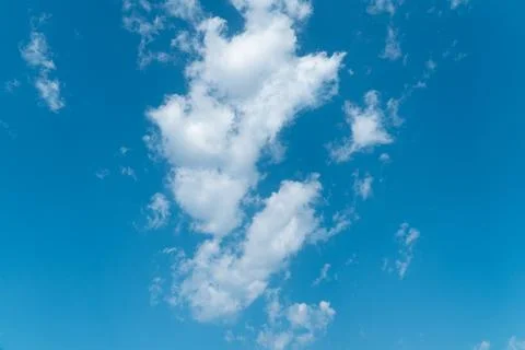 Daytime view of the blue sky with large white cumulus clouds Stock Photos