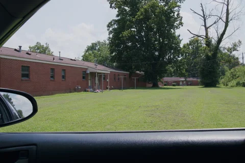 Daytime View from Car of Brick Residential Building Stock Footage 342159173