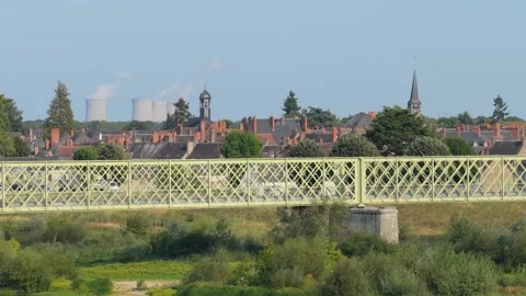 Daytime view of a historic metal bridge crossing lush greenery, with the Stock Footage 346675265