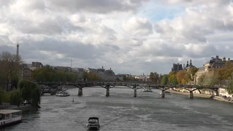 Daytime view of the Seine River and Pont des Arts in Paris with boats passing Stock Footage 320452205
