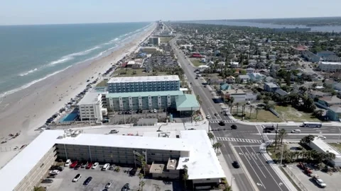 Daytona Beach, Florida with waves from the Atlantic Ocean, vehicles, hotels and Stock-Footage 309850422