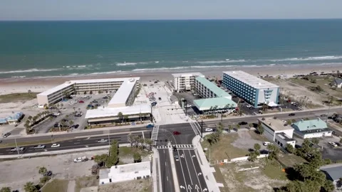 Daytona Beach, Florida with waves from the Atlantic Ocean, vehicles, hotels and Stock-Footage 309850452