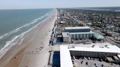 Daytona Beach, Florida with waves from the Atlantic Ocean, vehicles, hotels and Stock-Footage 309850458