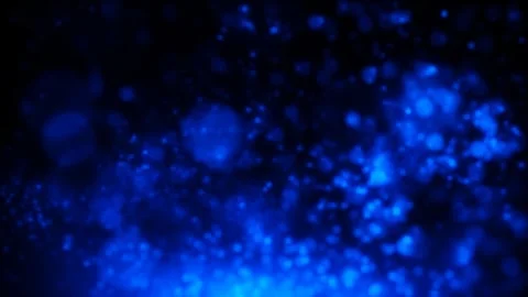 Dazzling blue particles float and swirl Stock Footage 303592472