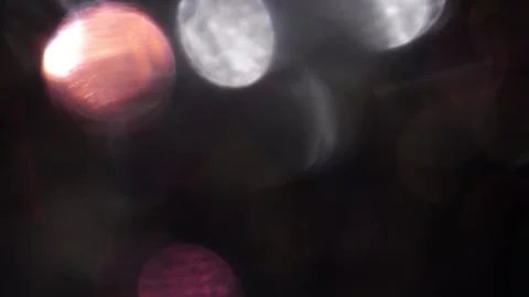 Dazzling colored bokeh lights in the dark Stock-Footage 318663114