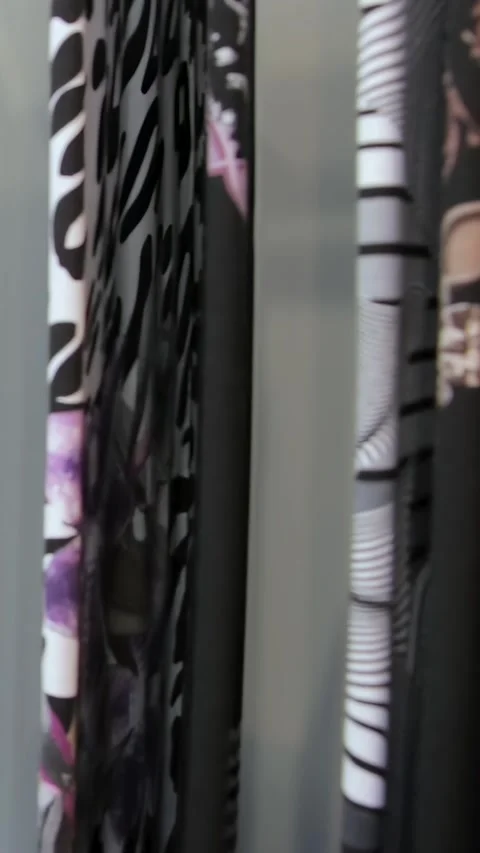 Dazzling Display of Patterned Fabrics and Fashion Garments Stock Footage 341068548