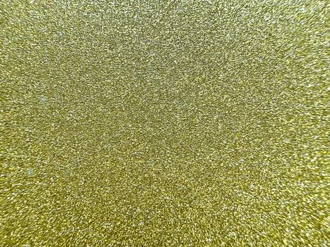 Dazzling gold glitter texture background with shimmering sparkle for festive  Stock Photos