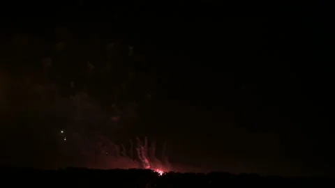 Dazzling large-scale fireworks with bright lights above the horizon. Live camera Stock Footage 111042916