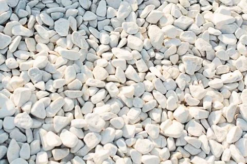 Dazzling white stones of different sizes, illuminated by the sun. Large and s Stock Photos